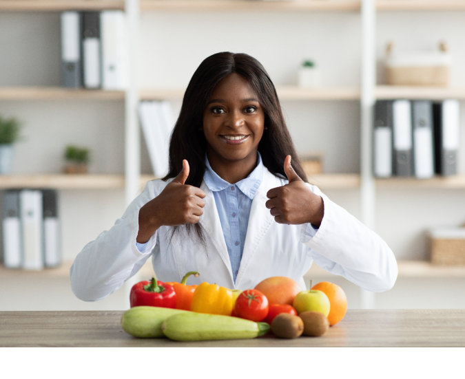 black lady doctor recommending nutritious fruits